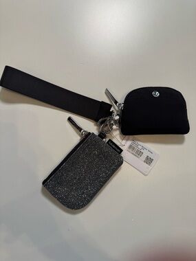 Lululemon NWT DUAL POUCH wristlet Glitter Color: DARKSLV/GRAPHITEGRAY/SILVER
